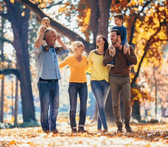 Extended family walking in an autumn forrest