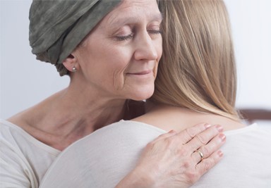 Cancer patient hugging another person